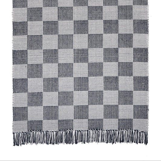 A traditional checkerboard pattern in classic charcoal and beige. Not as harsh as black and white but still within that neutral color palette. Coordinates with all decorating styles from modern to traditional. Shown here in a 6 foot long runner with fringed ends. Also available with bound ends.