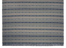 Geometric Checkerboard #90-G is a flat woven check design with various size squares that form an interesting pattern. This colorway works well in coastal or beach homes, or anywhere cooler colors are desired. Featuring blue, blue-green and cream, this versatile design is shown here in a large area rug size with fringed ends.