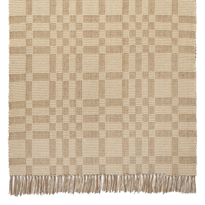 Geometric Checkerboard #34-L is a flat woven check design with various size squares that form an interesting pattern. This colorway works well in any home, but has a more modern feeling. Neutrals coordinate well with all styles and it is plain without being boring. This versatile design features khaki and natural beige and is shown here as a 27 inch wide runner with fringed ends.