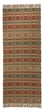 Geometric Checkerboard #90-M is a flat woven check design with various size squares that form an interesting pattern. This colorway works well in a more country or rustic home and features rust, tan, green and blue. This versatile design is shown here in a 27 inch wide runner with fringed ends.
