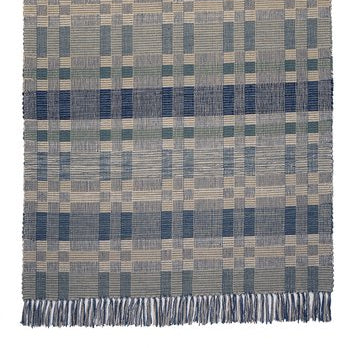 Geometric Checkerboard #90-G is a flat woven check design with various size squares that form an interesting pattern. This colorway works well in coastal or beach homes, or anywhere cooler colors are desired. Featuring blue, blue-green and cream, this versatile design is shown here in a 27 inch wide runner size with fringed ends.