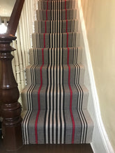 Hamilton #201-R is a bold flat woven rug design with black and red stripe on beige background shown here installed on stairs. 